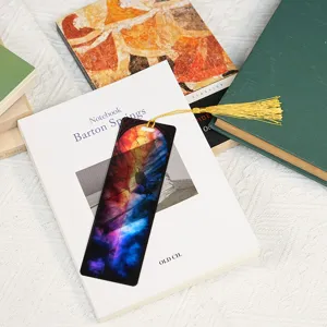 Acrylic stained glass dragon pattern bookmark detail view with gold tassel for students.