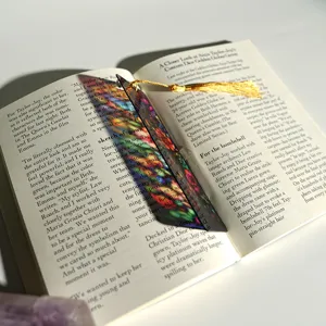 Creative acrylic translucent bookmark with golden tassel detailed scene close up shot
