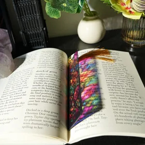 Colorful translucent acrylic bookmark with golden tassel refractive stained glass design aesthetic