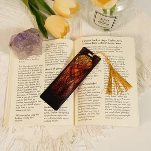 Exquisite translucent acrylic bookmark with dragon pattern and gold tassel for reading use.