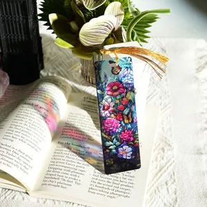 Colorful translucent acrylic bookmark with gold tassel, stained glass floral refractive design.