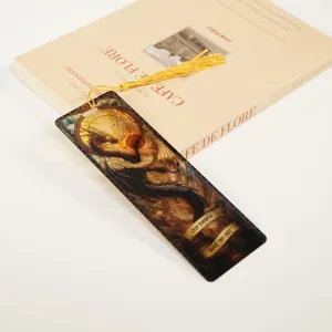 Acrylic bookmark with dragon design and golden tassel, beautiful reading accessory.