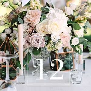 Clear acrylic wedding table number sign with arch design and white printed table 12 typography.