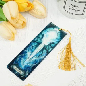 Acrylic bookmark with blue dragon pattern and gold tassel for students and reading lovers.