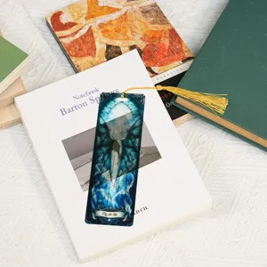 Translucent acrylic bookmark with dragon pattern and gold tassel for reading books.