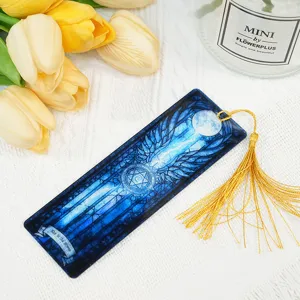Blue dragon acrylic bookmark with golden tassel, fantasy stained glass reading accessory.