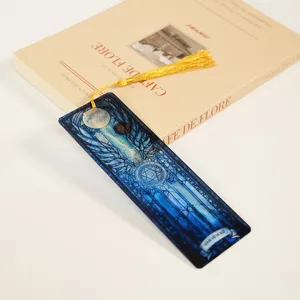 Translucent acrylic bookmark with dragon pattern and golden tassel for reading lovers.