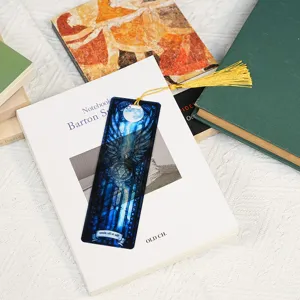 Transparent acrylic bookmark with golden tassel, beautiful stained glass fantasy design for reading.