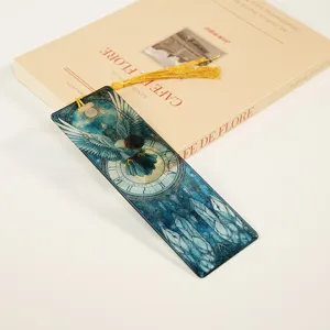 Transparent acrylic bookmark with gold tassel, fantasy eagle and clock design for students.