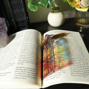 Close-up detail view of a colorful translucent acrylic bookmark featuring stunning light refraction effect.