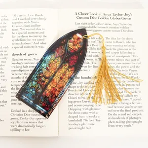 Exquisite acrylic stained glass bookmark with golden tassel, detailed gothic church window design.