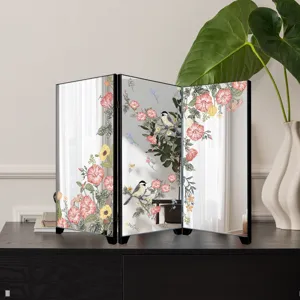 Miniature desktop mirror screen featuring elegant vintage floral and bird art print decoration.