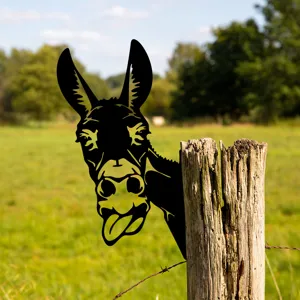 Close-up detail of a funny donkey metal silhouette peeking behind a wooden fence post in garden.