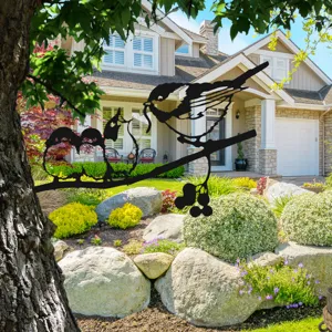 Metal bird silhouette garden stake, iron art tree branch outdoor yard decorative art ornament.