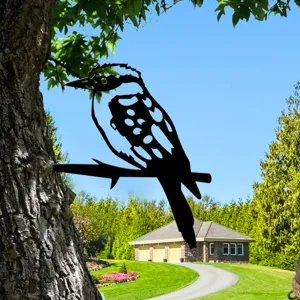 Metal bird silhouette garden stake, outdoor tree art decoration for yard and lawn decor.