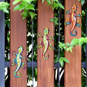 Metal gecko wall art detail, colorful lizard sculpture hanging for garden fence and outdoor decor.