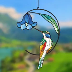 Stained glass hummingbird hanging ornament detail, beautiful window decoration for home.