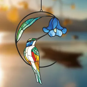 Detailed view of the exquisite stained glass metal hummingbird hanging ornament, perfect window decor.