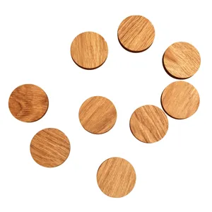 Wooden magnetic sticker detail, round wood grain design for fridge note fixing close-up.