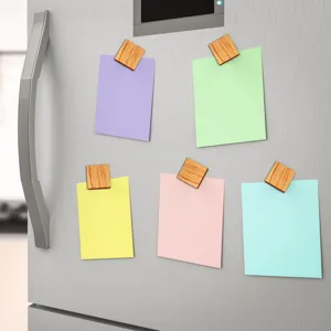 Wood grain magnetic fridge clips holding colorful notes, practical kitchen memo holder.