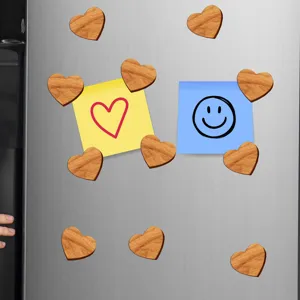 Wooden heart fridge magnets with wood grain texture, perfect for holding notes on metal surfaces.
