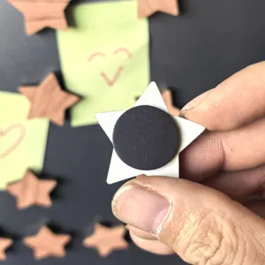 Wooden star fridge magnet detail showing the back magnetic disc for secure memo holding.