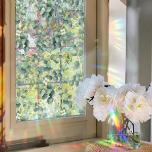 Rainbow window film with green leaves and flowers pattern, colorful prism glass sticker for home decor.