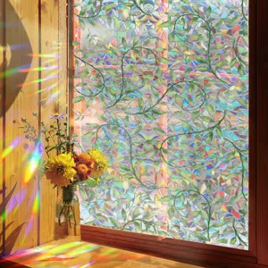 Decorative window film with vibrant rainbow prism effect and green vine leaf pattern for home.