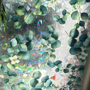 Close-up of holographic window film featuring botanical eucalyptus leaf print and rainbow prism effect.