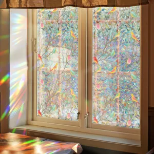 Detailed static window film featuring colorful bird and tree pattern with rainbow light effects.