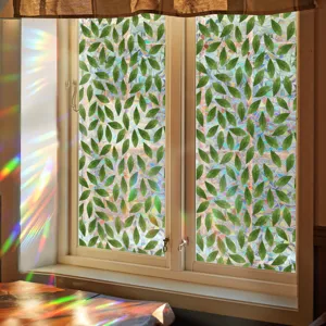 Colorful window privacy film with green leaf pattern, rainbow sun catcher for home glass decor.