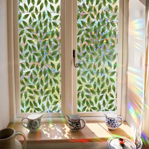 Decorative static cling window film featuring green leaves pattern and rainbow prism suncatcher effect.