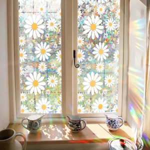 Detail view of colorful suncatcher window sticker with cute daisy pattern and rainbow prism effect.