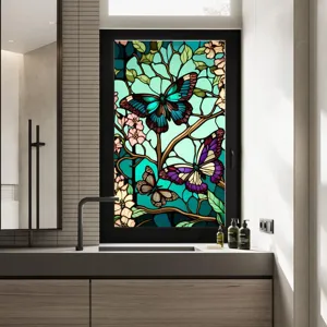 Stained glass window film detail showing retro butterfly and flower pattern on bathroom window.