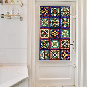Close-up detail of colorful vintage floral stained glass window film applied on white door