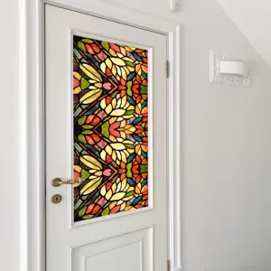 Close-up of colorful retro floral static window film on glass door, privacy decor sticker.