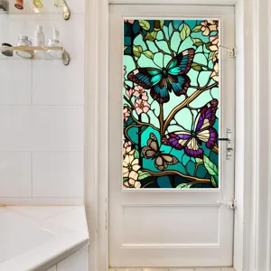 Close-up scene of retro butterfly stained glass window film applied on white door for privacy.