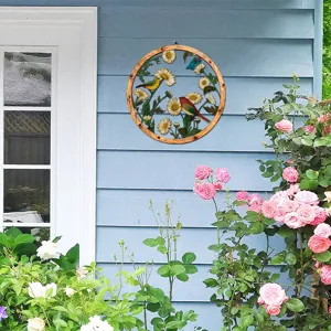 Wooden and metal wall hanging featuring floral daisy and bird design for home decor detail.