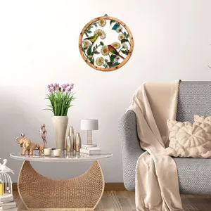 Wooden frame metal wall art hanging with birds and daisy flowers for living room decor.