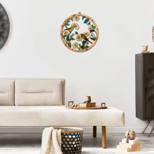 Round wooden frame metal wall art with flower and bird decor for modern living room styling.