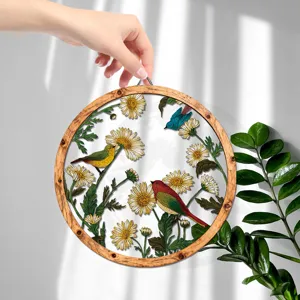 Wooden circular wall hanging decor with floral and bird design for home decor detail view.