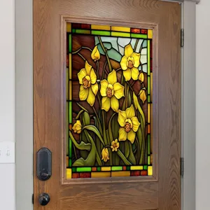 Stained glass window film detail showing vibrant yellow daffodils and green leaves on a door.