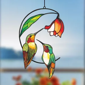 Stained glass hummingbird window hanging detail view, colorful metal art home decor ornament.