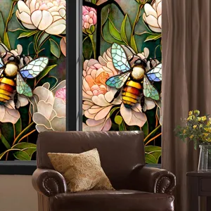 Detailed view of colorful floral and bee static window film applied on glass, home decor.