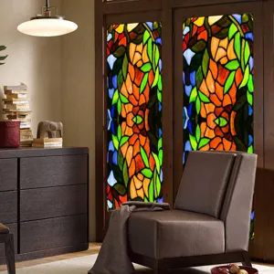 Decorative stained glass window film detail showing retro colorful floral pattern applied on glass.