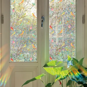 Colorful stained glass window film with tree and bird pattern for home decor detail view.