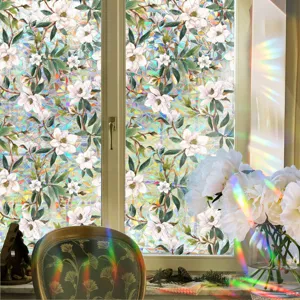 Prismatic rainbow window film with elegant white magnolia flower pattern for glass and home decor.