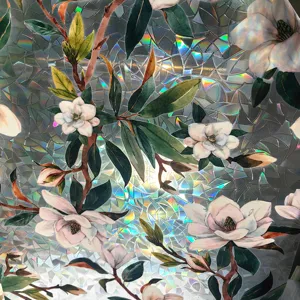 Decorative window film detail featuring beautiful magnolia floral pattern with 3D prism rainbow effect.