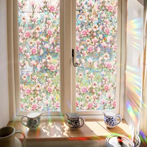 Detail view of pink magnolia floral window film showing colorful 3D prism rainbow light effect.