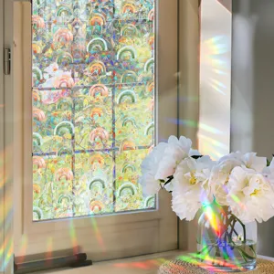 Detail view of iridescent glass window film, creating beautiful rainbow light refractions.